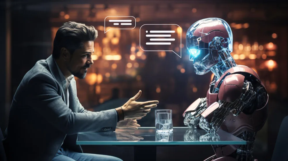 Businessman talking to robot at table